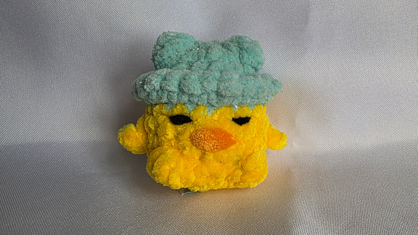 Léon le poussin à chapeau