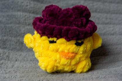 Léon le poussin à chapeau