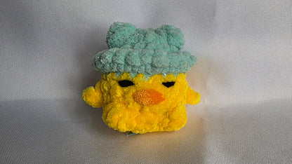 Léon le poussin à chapeau