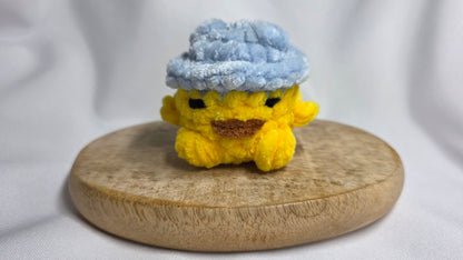 Léon le poussin à chapeau